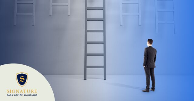 Staffing firm leader evaluating multiple ladders representing when factoring for staffing firms stops scaling